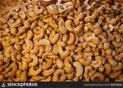 Heap of salted roasted cashew nuts.