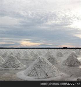heap of sea salt with beautiful sky background
