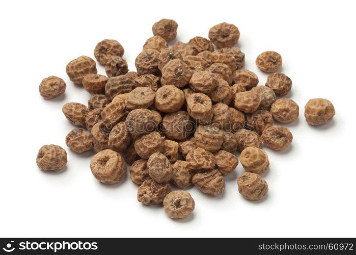 Heap of shelled Chufa nuts on white background
