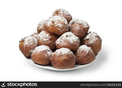 Heap of sugared fried fritters or oliebollen on white background