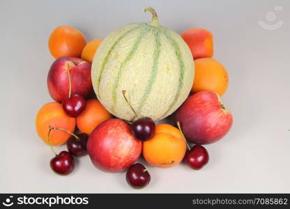 Heap of summer fruits : apricots, nectarines, cherries and melon