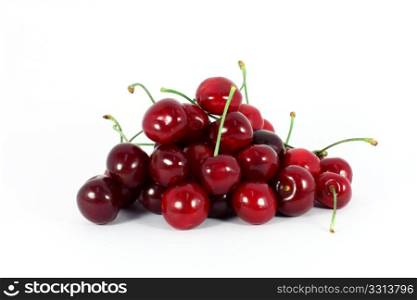 Heap of sweet cherries isolated on white