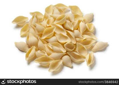 Heap of traditional Italian conchiglie on white background