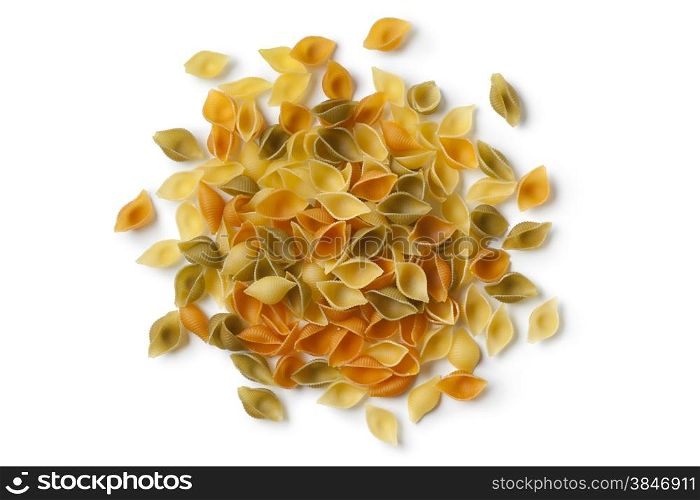Heap of traditional Italian Conchiglie tricolore on white background