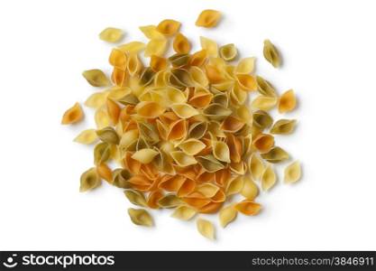 Heap of traditional Italian Conchiglie tricolore on white background