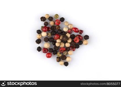 heap of various pepper peppercorns seeds mix on white