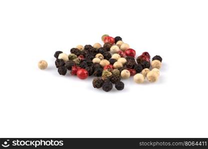 heap of various pepper peppercorns seeds mix on white