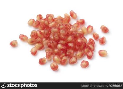 Heap of white pomegranate seeds close up on white background