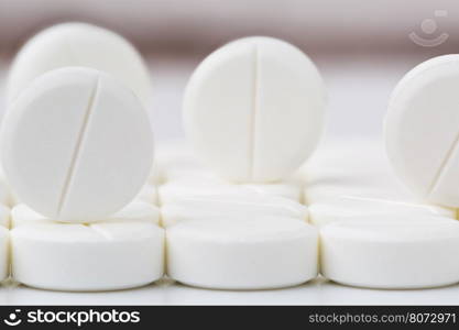 Heap of white round pills and tablets. Heap of round white pills and tablets