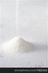 Heap of white sugar close-up