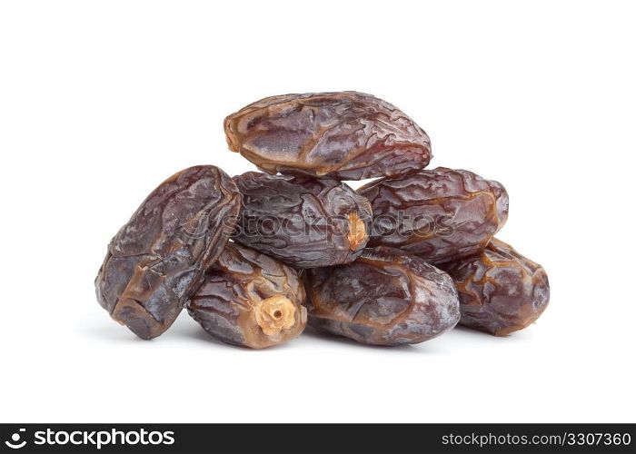 Heap of whole dried dates on white background