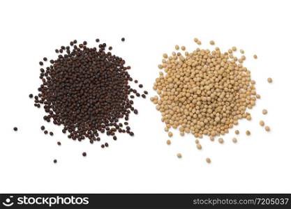 Heap of yellow and brown mustard seed isolated on white background