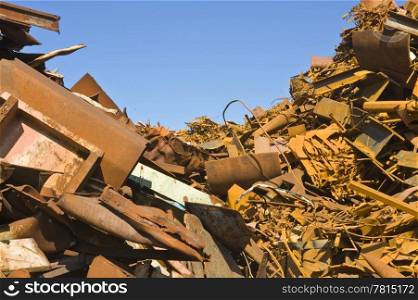 Heaps of different kinds of metal scrap in a scrap yard