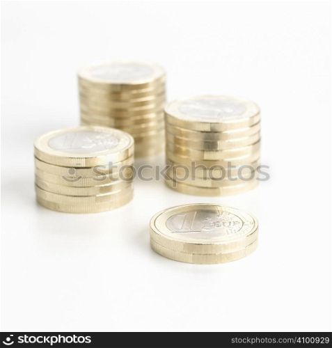 Heaps of euro coin isolated on white