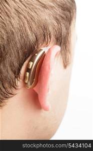 Hearing aid on the man&#39;s ear closeup