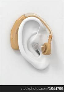 Hearing aid on white ear. Three-dimensional image. 3d