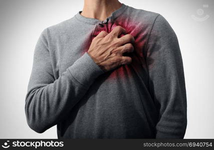 Heart attack pain medical disease concept as a man suffering from a cardiac illness as a painful coronary event.