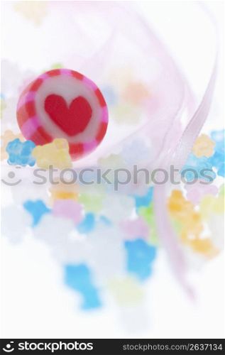 Heart candy sweet and colourful tiny sweets in a baby pink bag