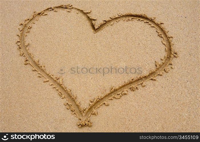 Heart drawn on sand for the day of St. valentine