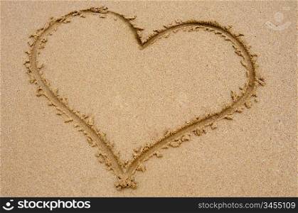 Heart drawn on sand for the day of St. valentine