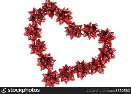 Heart from red bows isolated on white background