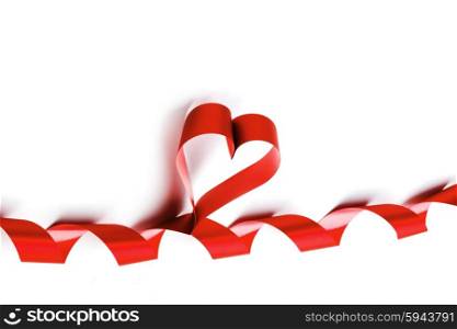 Heart from red ribbon isolated on white background