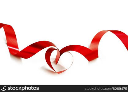 Heart from red ribbon isolated on white background