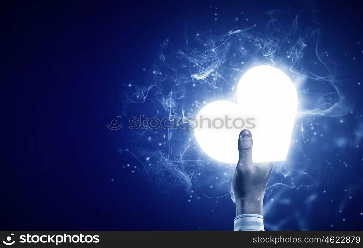 Heart in hand. Person holding digital glowing heart in palm