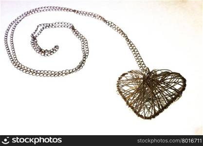 heart jewelry from silver wire on a white background