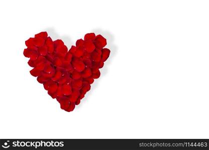 Heart made from red rose petals isolated on white background . Top view, flat lay. Copy space. Heart made from red rose petals isolated on white background .