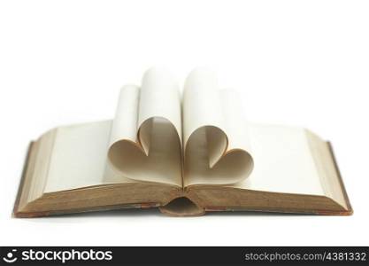 Heart made of blank pages inside a book on white background
