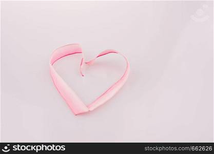 Heart made of ribbon on a white background