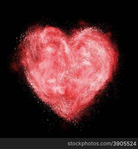 heart made of white powder explosion isolated on black background