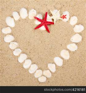 heart made with shells. Heart shape on sand