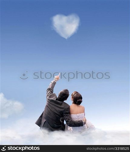 Heart of cloud - studio shot of a wedding couple