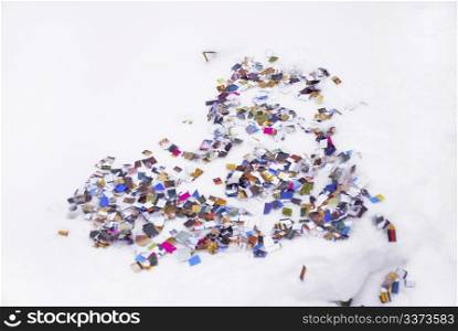 Heart of confetti isolated on white