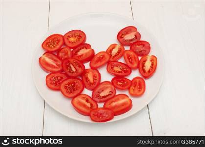 Heart of Fresh Tomatoes on White Plate on Table