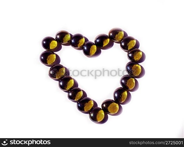 Heart of golden beads on a white background