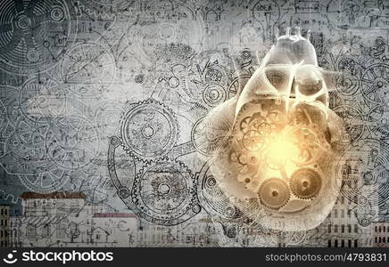 Heart of mechanism. Close up of human heart and cogwheel mechanisms