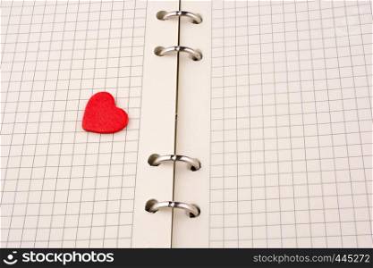 Heart on a checked notebook