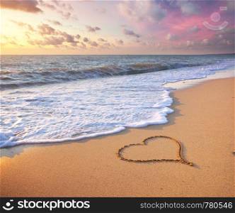 Heart on beach. Romantic composition.