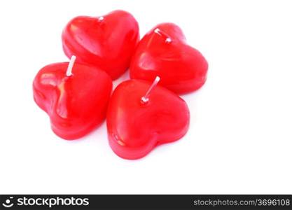 Heart shape candles isolated on white background.