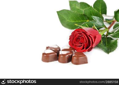 Heart shape chocolate and red rose isolated on white