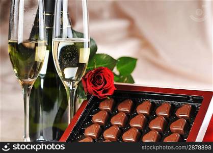 Heart shape chocolate, champagne and red rose
