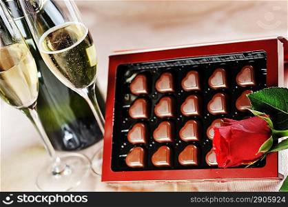 Heart shape chocolate, champagne and red rose