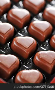Heart shape delicious chocolate in box close-up
