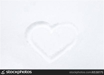 Heart shape drawing on white snow. Heart shape drawing on white snow as love valentine background