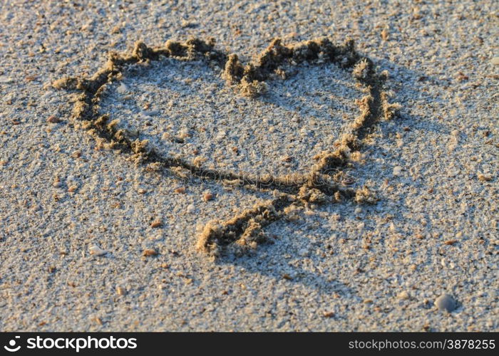 heart shape drawn in the sand baech