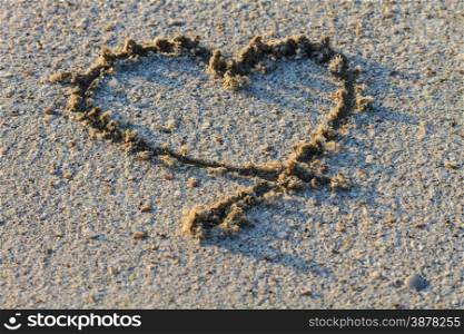 heart shape drawn in the sand baech