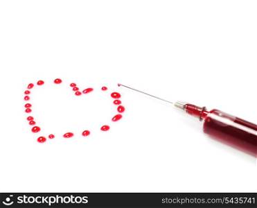 Heart shape from drops of red liquid in syringe isolated on white background